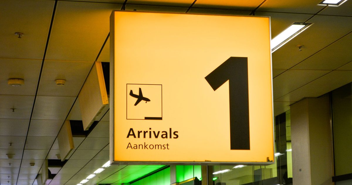 An arrivals sign in an airport terminal