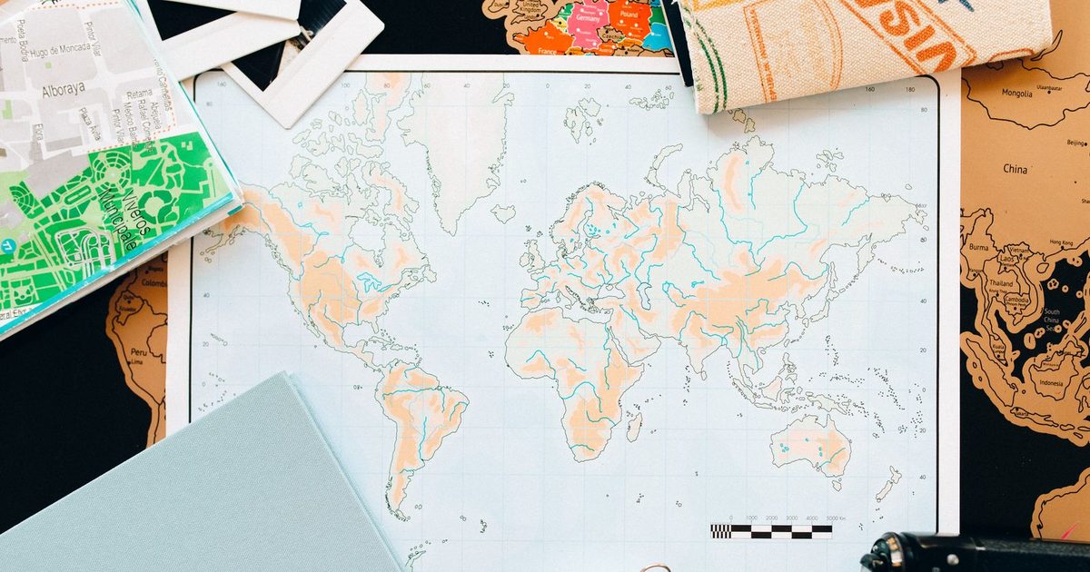 A world map and compass